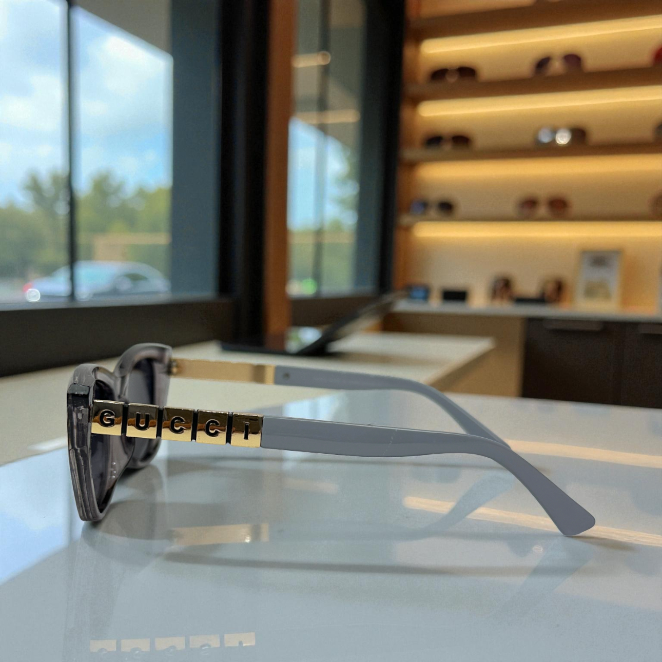 Bold Full-Grey Cat Eye Sunglasses with Gold Logo Temple Detail