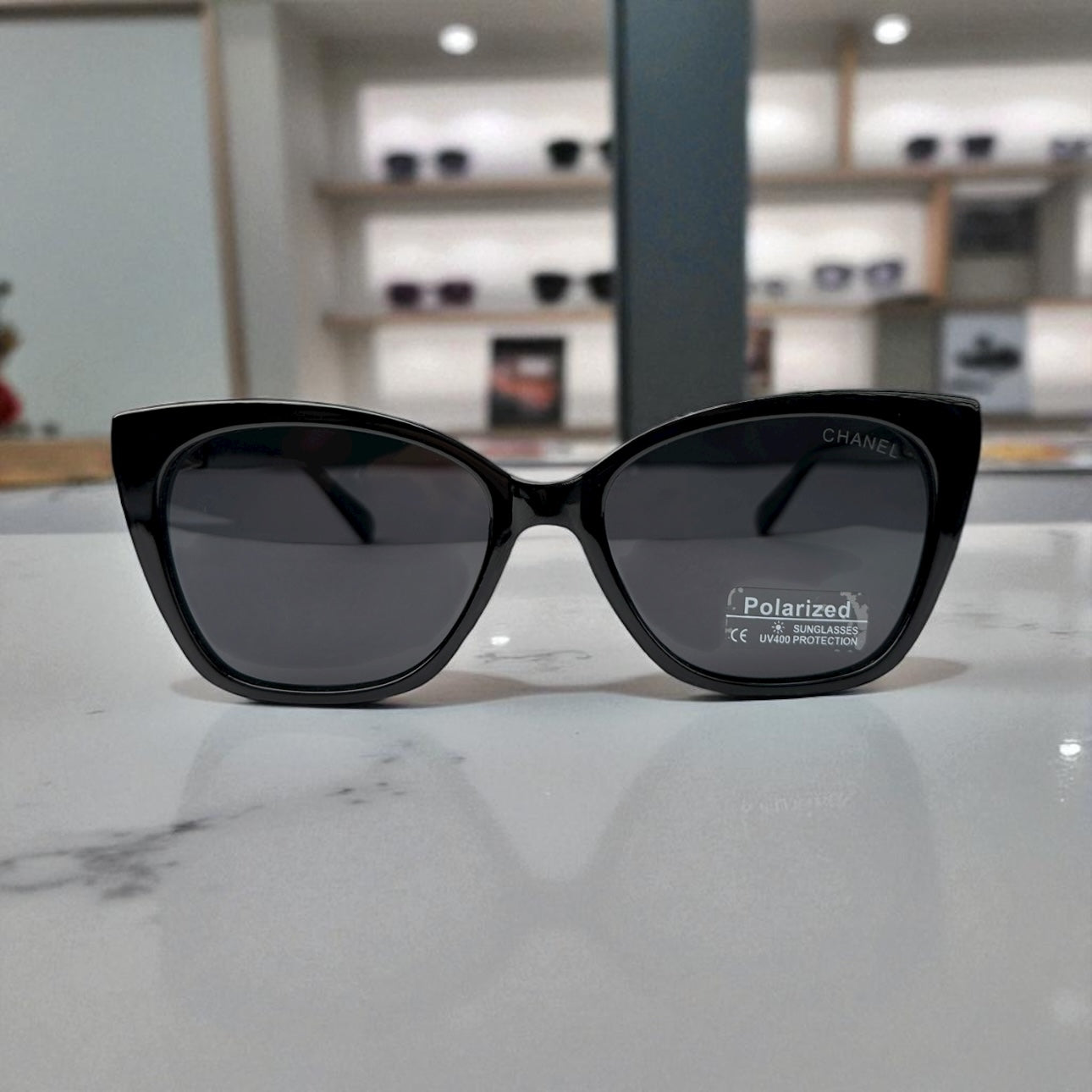 Sleek Black Chanel Cat-Eye Sunglasses with Gold Accents