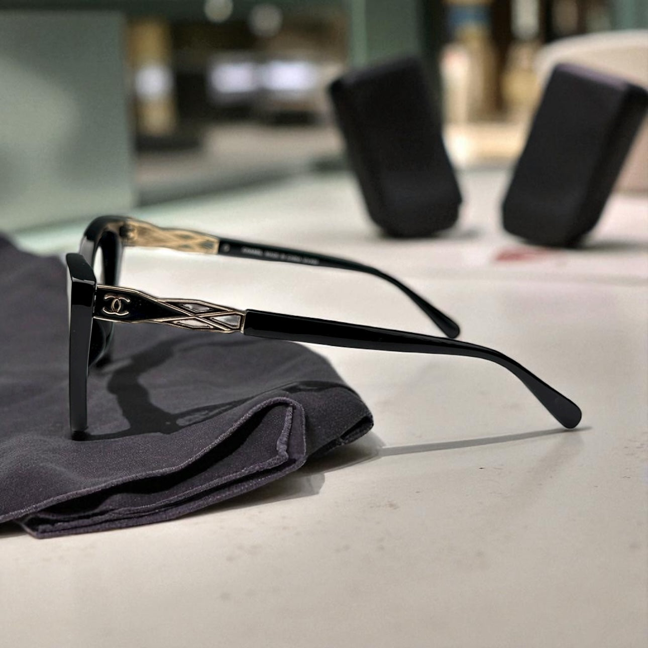 Sleek Black Chanel Cat-Eye Sunglasses with Gold Accents