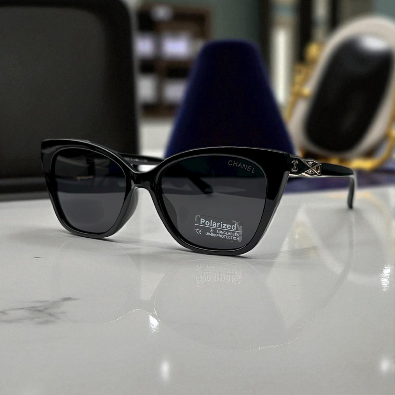 Sleek Black Chanel Cat-Eye Sunglasses with Gold Accents