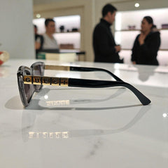 Bold Clear-Grey Cat Eye Sunglasses with Gold Logo Temple Detail