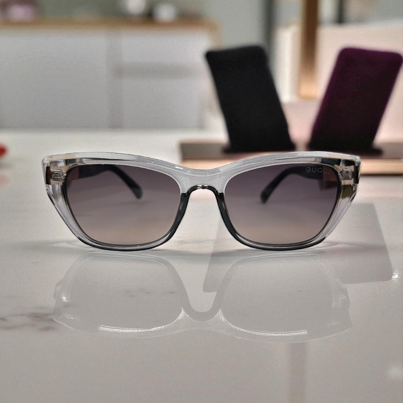 Bold Clear-Grey Cat Eye Sunglasses with Gold Logo Temple Detail