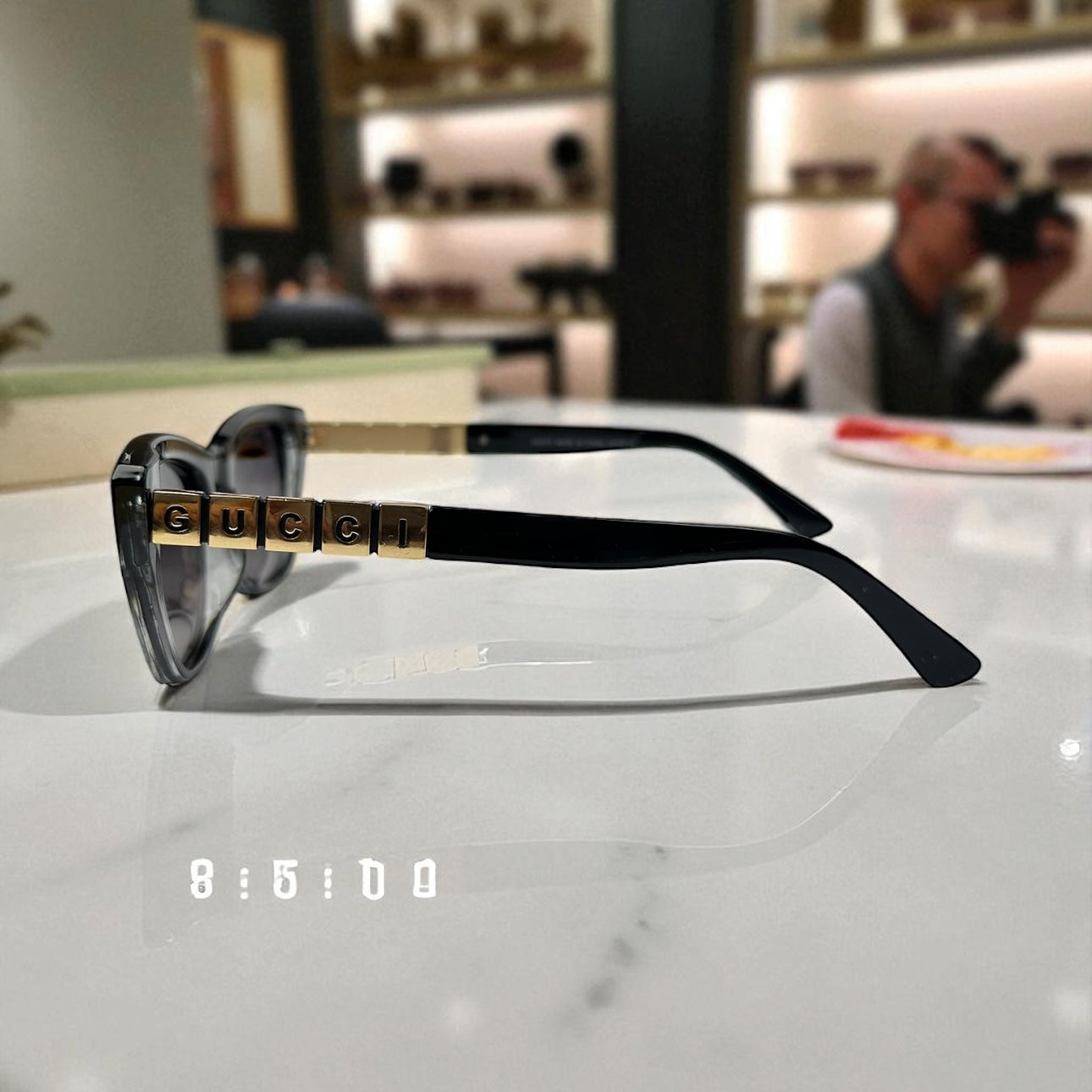 Striking Black-to-Clear Cat Eye Sunglasses with Gold Logo Temple