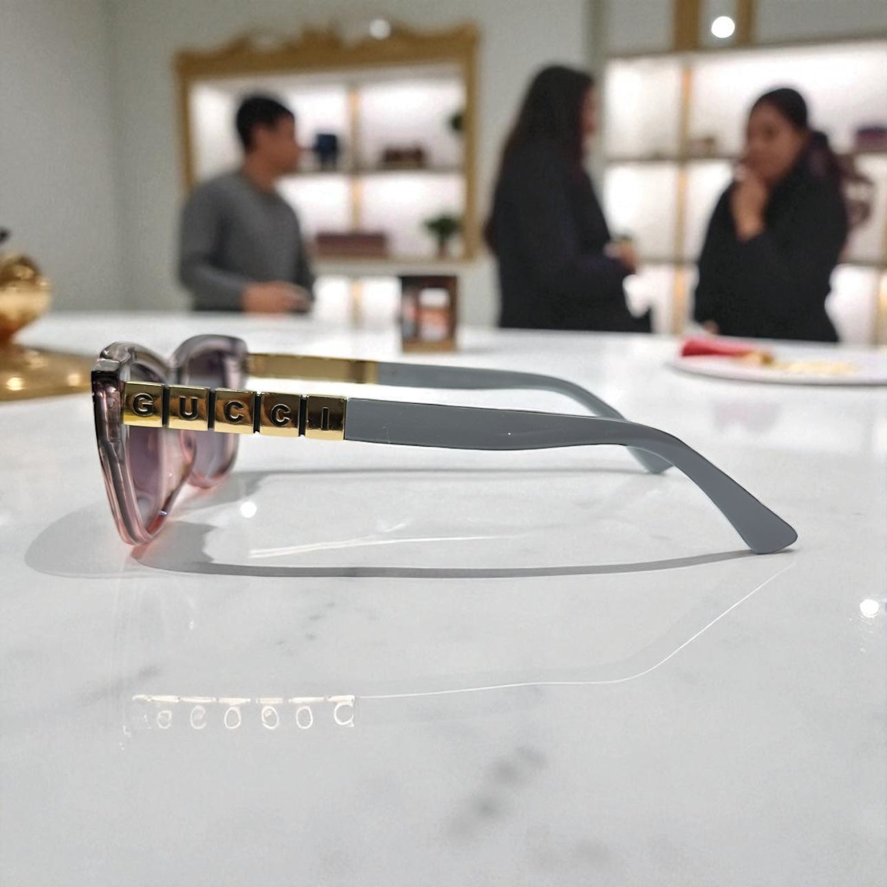 Playful Pink & Grey Cat-Eye Gucci Sunglasses with Bold Gold Logo Temple