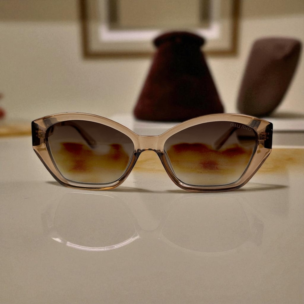 Miu Miu Cat-Eye Polarized Sunglasses – Nude Gradient Frame with Gold Detail UV400