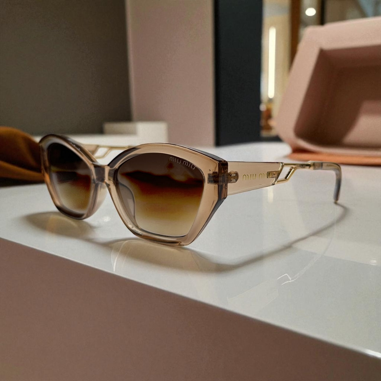 Miu Miu Cat-Eye Polarized Sunglasses – Nude Gradient Frame with Gold Detail UV400