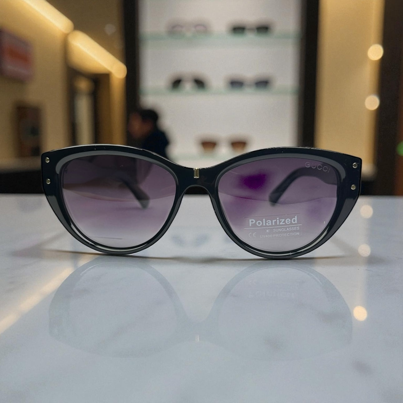 Gucci Polarized Sunglasses – Black Frame with Gold GG Detailing & UV400 Protection