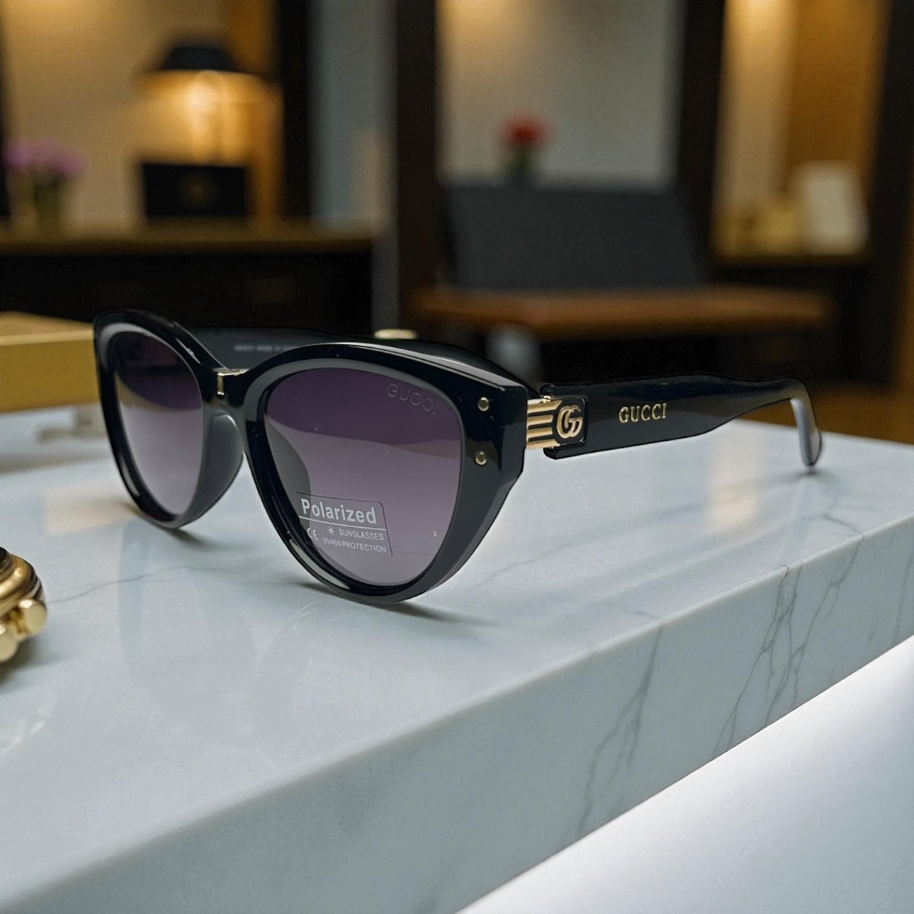 Gucci Polarized Sunglasses – Black Frame with Gold GG Detailing & UV400 Protection