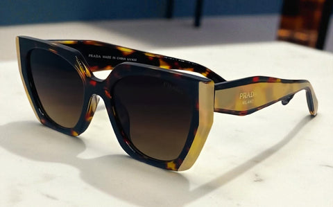 Bold Tiger Prada Sunglasses with Gold Accents